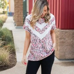 Boutique Simplified Chasing Arrows Short Sleeve Top